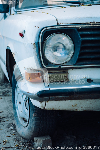 Image of old abandoned white car