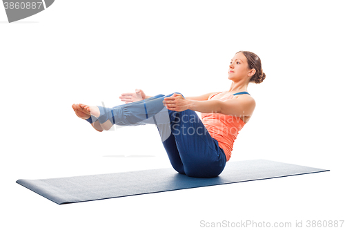Image of Sporty fit woman doing Ashtanga Vinyasa yoga asana Paripurna nav