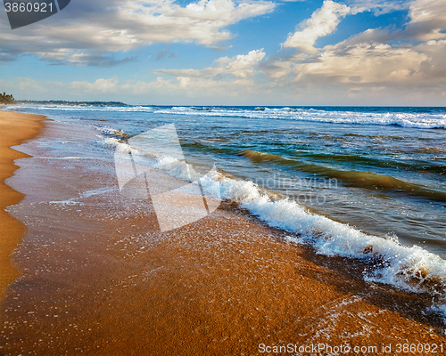 Image of Wave surging on sand