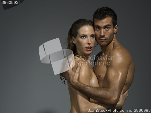 Image of nude couple in love over grey blackground