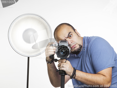 Image of professional photographer with photographic equipment