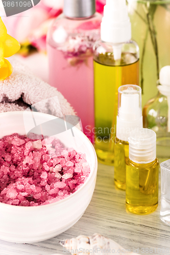 Image of Spa setting with pink roses and aroma oil, vintage style 