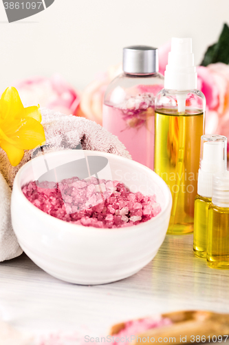 Image of Spa setting with pink roses and aroma oil, vintage style 