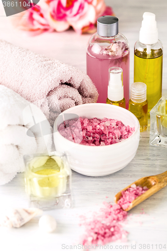 Image of Spa setting with pink roses and aroma oil, vintage style 