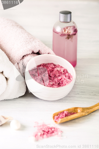 Image of Spa setting with pink roses and aroma oil, vintage style 