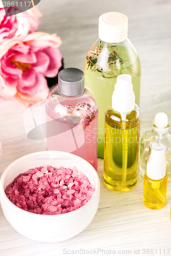 Image of Spa setting with pink roses and aroma oil, vintage style 