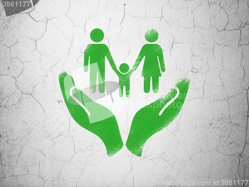 Image of Insurance concept: Family And Palm on wall background