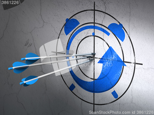 Image of Timeline concept: arrows in Alarm Clock target on wall background