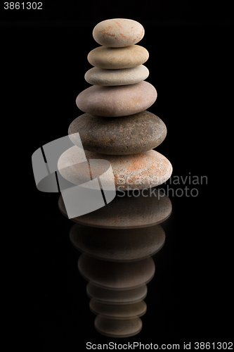 Image of balancing zen stones on black