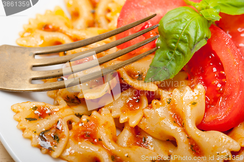 Image of Italian pasta farfalle butterfly bow-tie and tomato sauce