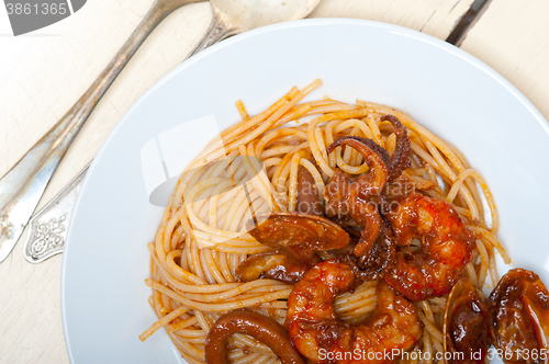 Image of Italian seafood spaghetti pasta on red tomato sauce 