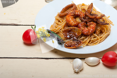Image of Italian seafood spaghetti pasta on red tomato sauce 