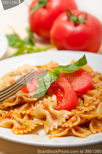 Image of Italian pasta farfalle butterfly bow-tie and tomato sauce