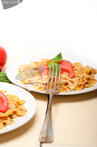 Image of Italian pasta farfalle butterfly bow-tie and tomato sauce