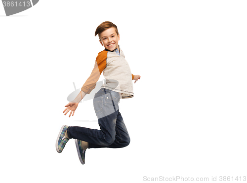 Image of happy smiling boy jumping in air