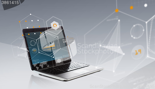 Image of laptop computer with chart and geometric shapes