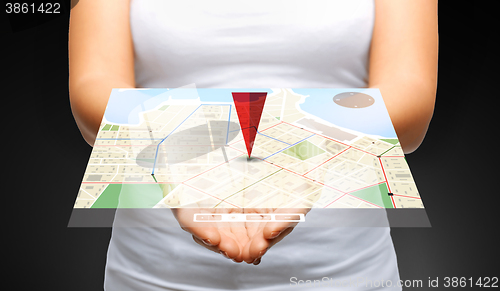 Image of close up of womans hands showing gps navigator map