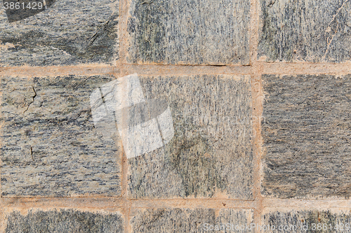 Image of close up of paving stone or facade tile texture