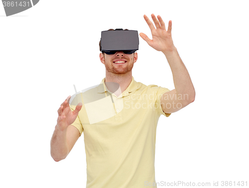 Image of happy man in virtual reality headset or 3d glasses