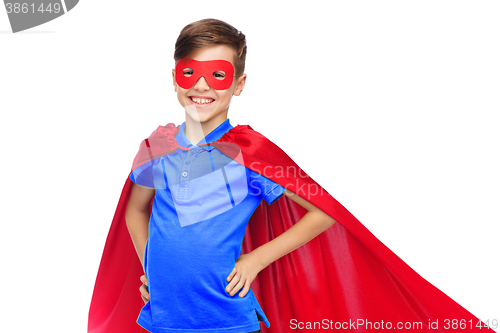 Image of happy boy in red superhero cape and mask