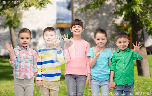 Image of happy smiling little children holding hands
