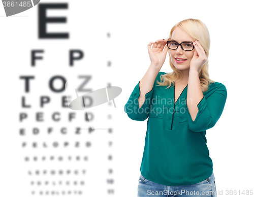 Image of smiling young woman with eyeglasses