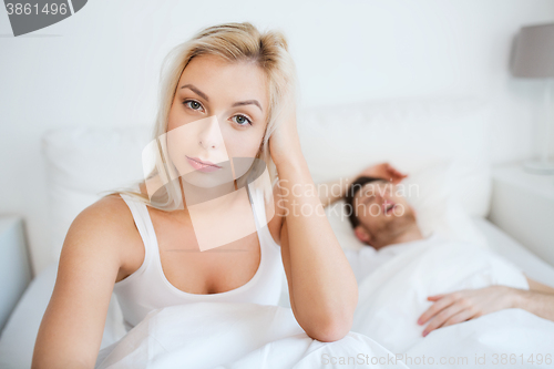 Image of awake woman having insomnia in bed