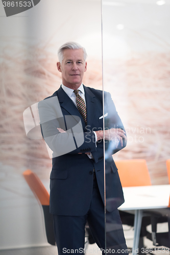 Image of portrait of handsome senior business man at modern office