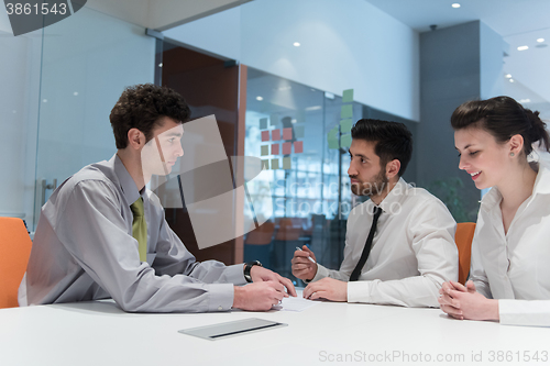 Image of young couple signing contract documents on partners back