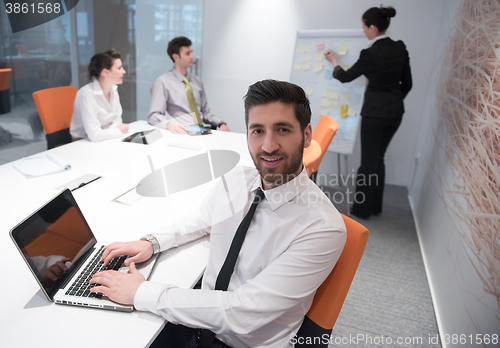 Image of young business man at meeting