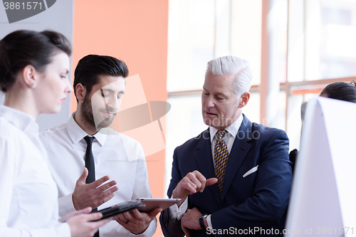 Image of young startup businessman making presentation to senior investio