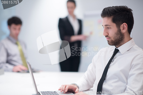 Image of young business man at meeting