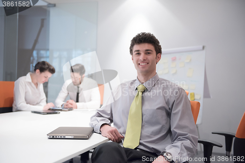 Image of portrait of young business man at modern office