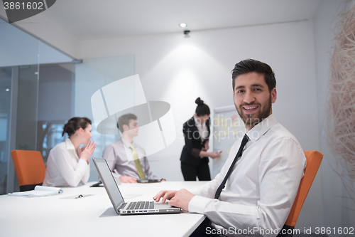 Image of young business man at meeting