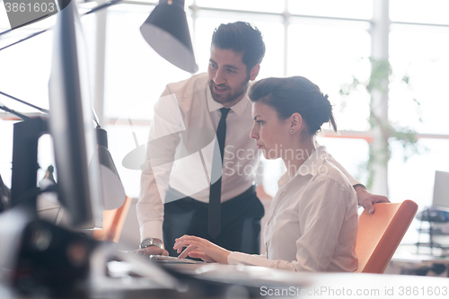 Image of business couple working together on project