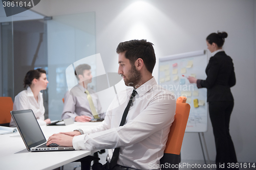 Image of young business man at meeting