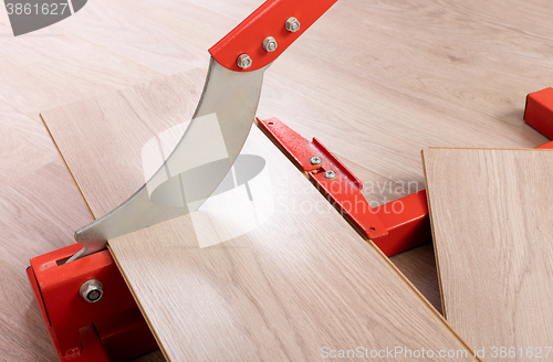 Image of Red tool for cutting laminate