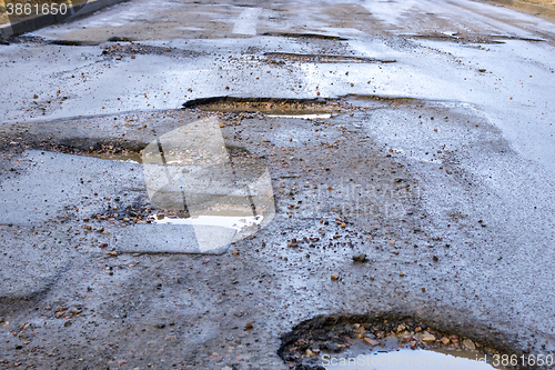 Image of Bad road with pits in asphalt