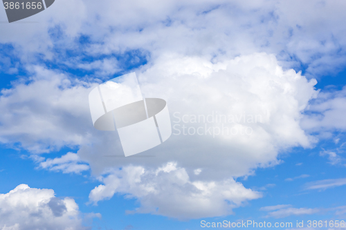 Image of Snow-white cloud in blue sky