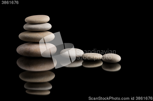 Image of balancing zen stones on black