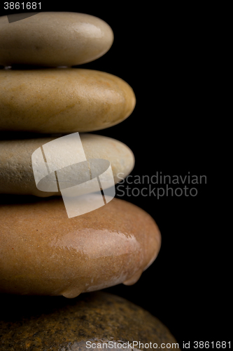 Image of balancing zen stones on black