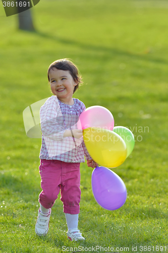 Image of Girl with colorful balloons