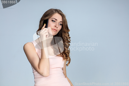 Image of Portrait of young woman with phone