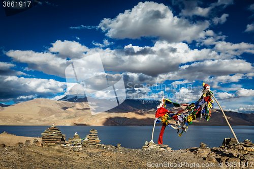 Image of Buddhist prayer flags lungta at Himalayan lake