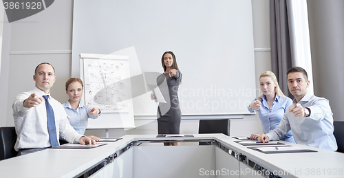 Image of group of businesspeople pointing finger at you