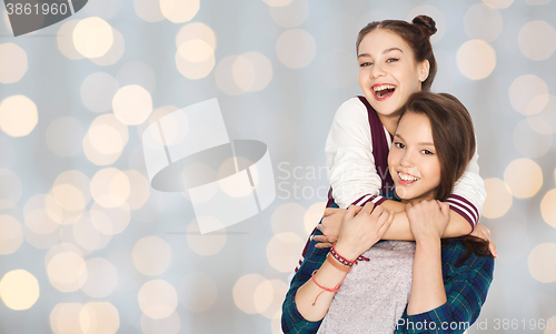 Image of happy smiling pretty teenage girls hugging