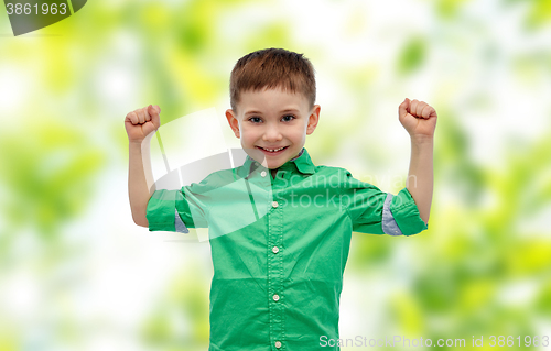 Image of happy smiling little boy with raised hand