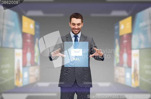 Image of businessman working with email icon