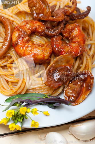 Image of Italian seafood spaghetti pasta on red tomato sauce 