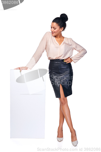 Image of Smiling businesswoman with banner